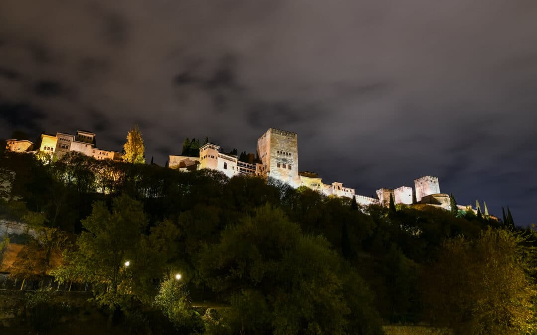 View Of Illuminated Alhambra Palace In Granada, Spain At Night.